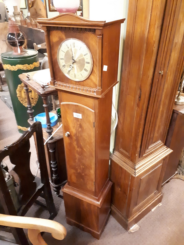 Mahogany grand daughter clock, battery driven.