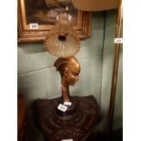 Art Deco style bronze lamp with wooden base