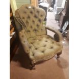 Victorian upholstered open armchair raised on cabriole legs.