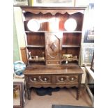 19th C. carved oak dresser.