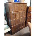 1930's oak bank of sixteen drawers. { 160cm H X 95cm W X 61cm D }.