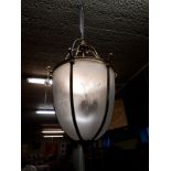 Brass and etched glass lantern in the form of an acorn.