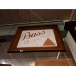 BASS IN A BOTTLE glass advertisement in original frame.