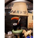 Rare Guinness Toucan Carlton ware lamp with original shade.