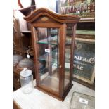 Early 20th C. mahogany shop display cabinet with mirrored back.