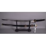 Una katana con decori in bronzo. Giappone. XX secolo. Mis. Lung. cm. 103 ca.