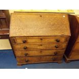 GEORGE III OAK BUREAU, THE FALL ENCLOSING A FITTED INTERIOR ,