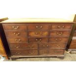 GEORGE III LANCASHIRE MAHOGANY CHEST OF THIRTEEN DRAWERS ON BRACKET FEET