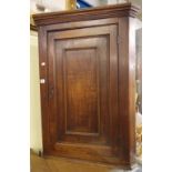 GEORGE III OAK HANGING CORNER CUPBOARD WITH FIELDED PANEL DOOR