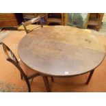 GEORGE II WALNUT OVAL DROPFLAP CIRCULAR DINING TABLE