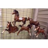 FIVE BESWICK BROWN GLOSS HORSES -RECUMBENT AND PRANCING