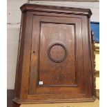 GEORGE III OAK HANGING CORNER CUPBOARD WITH MOULDED ROUNDEL