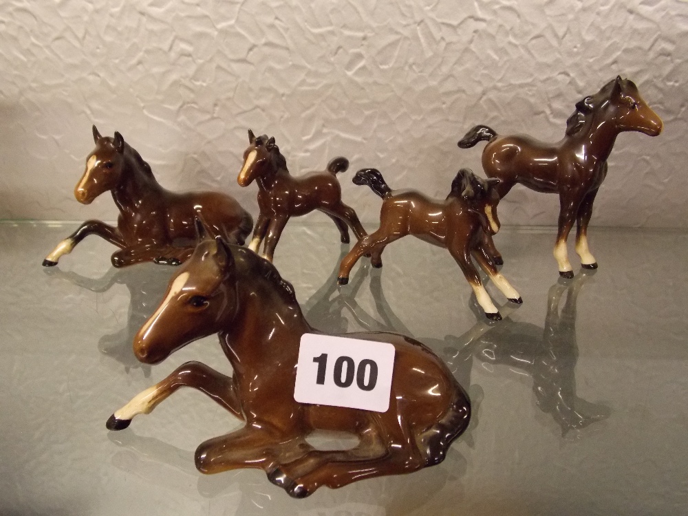 FIVE BESWICK GLOSS FOALS -RECUMBENT AND OUTSTRETCHED LEGS