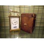 BRASS CARRIAGE CLOCK IN LEATHER CASE ENAMEL DIAL AND GLASS A/F