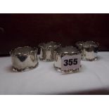 SET OF FOUR SILVER NUMBERED NAPKIN RINGS