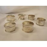 SIX SINGLE SILVER NAPKIN RINGS SOME WITH ENGRAVED DECORATION - LONDON,
