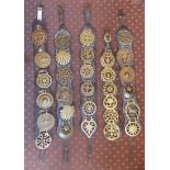 VINTAGE HORSE BRASSES ON FIVE LEATHER SADDLE STRAPS