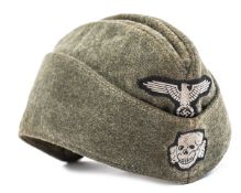 A Waffen SS man’s forage cap, field grey serge material with machine sewn BeVo eagle and skull