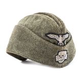 A Waffen SS man’s forage cap, field grey serge material with machine sewn BeVo eagle and skull