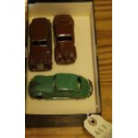 3 Dinky Toys. A Chrysler Airflow Saloon 30a in green with black ridged hubs, a Packard 39a and a