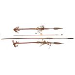 A fishing spear, leaf blade on socket 15”, wooden haft 54” overall; a Chinese arrow, label states “