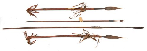 A fishing spear, leaf blade on socket 15”, wooden haft 54” overall; a Chinese arrow, label states “