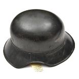 A Third Reich 3 piece “Gladiator” type Luftschutz helmet, the rear brim with stencilled markings,