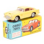 A Corgi Toys Aston Martin D.B.4 (218). An example in primrose yellow with red interior, example with