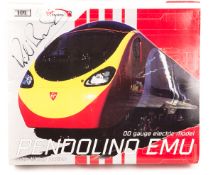 A Dapol & Virgin Trains set. Cover with Richard Branson original signature. A Pendolino EMU with