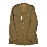 A WWII period Captain’s khaki SD tunic of The R Tank Regt, embroidered badge to right sleeve, GC (