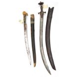 A Khyber knife, of traditional form, blade 21”, in scabbard and a tulwar, curved blade 28”,