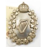 A post 1902 silver plated plume holder of an Irish Regiment, harp within crowned oval shamrock