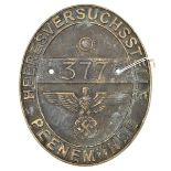 An oval cast brass plaque, 7½” x 6½”, embossed around the edge “Heeresversuchsstelle Peenemunde”,