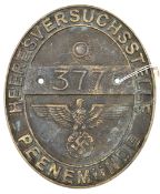 An oval cast brass plaque, 7½” x 6½”, embossed around the edge “Heeresversuchsstelle Peenemunde”,