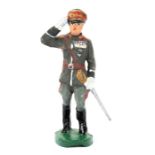 An Elastolin figure of Field Marshall Rommel. Saluting in full grey ceremonial uniform, wearing