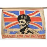 A colour stencilled WWII banner of F Marshal Montgomery, head and shoulders, with distant background