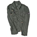 A Third Reich panzer style dark green herring bone weave pocketless jacket, with single row of