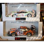 3 1:18 scale racing cars. 2x UT Models Le Mans style Sports GT – Porsche 911 GT2 in black/orange