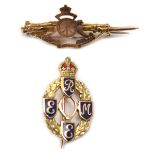 A gold “sweetheart” tie pin of The R Artillery, badge on rifle and bayonet, marked “9ct Gold” and “A