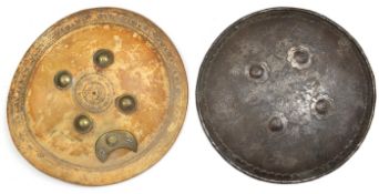 A circular light brown hide shield, with 4 brass bosses and stars on crescent device, and a steel