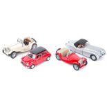 4 Franklin Mint 1:24 scale cars. 1967 Mini Cooper in red with black roof. 1948 MG TC in red. 1952