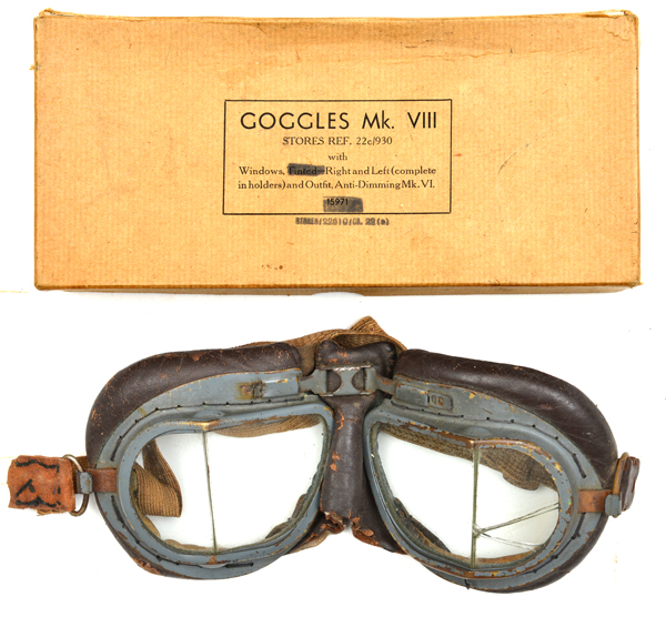 A pair of WWII period goggles, (some service wear, one side panel cracked) in a later cardboard