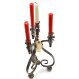 A steel candelabrum, formed from 3 complete mid 19th century continental socket bayonets curled at