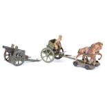 A scarce Hausser horse drawn howitzer. A 2 horse team with rider, tinplate limber with two riders