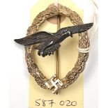 A scarce Third Reich Glider Pilot’s badge, with narrow silvered wreath and black eagle stamped on