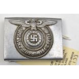 A Third Reich SS man’s aluminium buckle, with integral loop, the back embossed with RZM mark, “36/