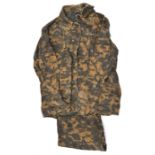 A Third Reich heavy linen SS camouflage jacket and trousers, the jacket lining stamped with SS