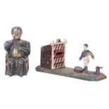 2 cast iron copy money banks. A Football Bank. Player kicks the coin into the goal when the lever is