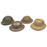 A WWII steel helmet, original khaki paint, liner and chinstrap, d. 1940, near VGC; another “