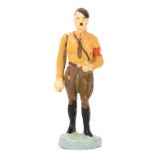 An Elastolin figure of Adolf Hitler. Standing in S.A. brown shirt uniform with moveable arm. VGC,